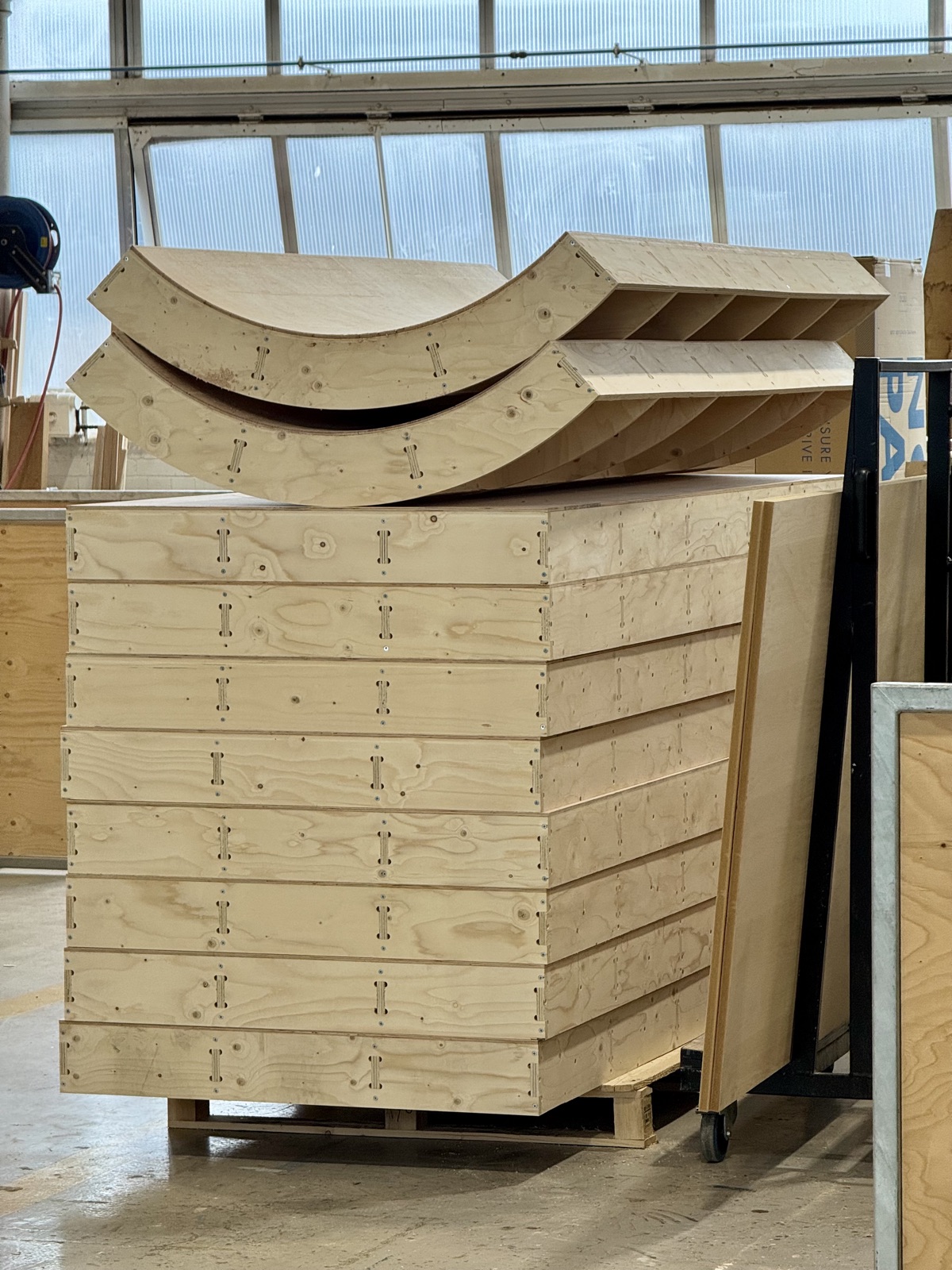 CNC-cut curved plywood walls for a pop-up retail space